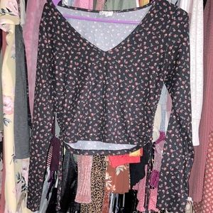 Black crop top. Flowers, long sleeves. Comfy material.